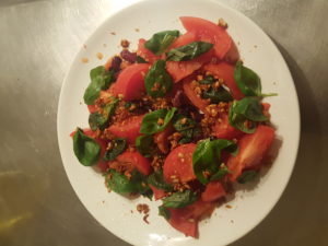 Sprouted sunflower seeds and grains with spices, red beans, fresh basil, boiled tomatoes, olive oil. Hot dish