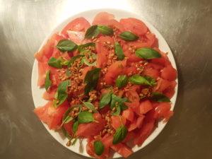 Tomatoes, basil, wheat sprouts and sunflower seeds with oriental species