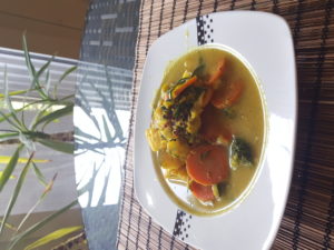 Quinoa with creamy fresh pressed coconut milk and vegetables (zucchini, broccoli, cauliflower, carrots, chives fresh from the garden). Curcuma with a hint of black pepper, cinnamon, ginger, nutmeg