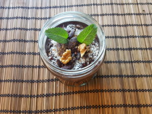 Cocoa custard with fig paste and creamy fresh pressed coconut coconut milk. Topping : grated coconut, cocoa nibs, moroccan mint, walnuts