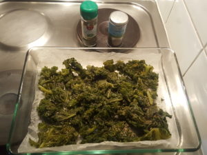 Crispy and hot cabbage kale chips with salt, oregano, basil and provencal herbs