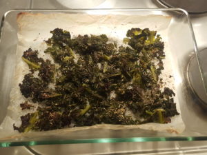 Crispy and hot cabbage kale chips with salt, oregano, basil and provencal herbs