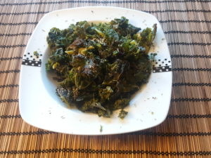Crispy and hot cabbage kale chips with salt, oregano, basil and provencal herbs