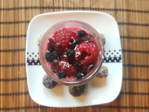 Raspberries custard and energy aronia- peach-raspberry-date-coconut balls. Raspberries, soy yogurt. Topping :aronia, raspberries, dried cranberries 