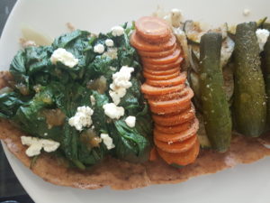 Quiche with homemade whole spelled dough. Onion, spinach and cottage cheese filling, caramelized onion topping on the right. Stuffed with onions, zucchini on the left and onions and carrot in the center. Species provence herbs, basil, rosemary