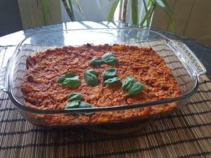 Oat pizza: oats, zucchini, carrots, organic tomato toscana, basil, organic pizza species with oregano