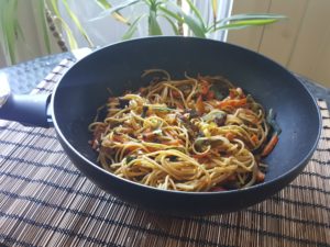 Asian wok with yellow lentils spaghetti 