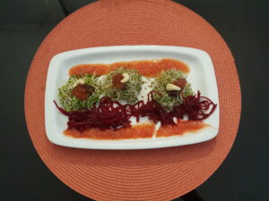Sprouts, tomato marmalade, fresh tomato sauce, beet, blueberries, cashew 