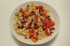 Bulgur, red yellow and orange baked pepper, raisins, goji berries