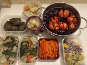 Winter batch cooking for all week. Red cabbage, paksy cabbage, broccoli, coloured cauliflower, tomato, coloured peppers, vegetable broth, onion, celery, parsnip, green cabbage, carro.