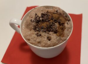Maca - pure cocoa hot shake with cinnamon and cocoa beans . Prepared with almond milk, and shaked it after being hot in order to get an amazing foam taste together with the cocoa beans and cinnamon. Plenty of energy for those previous and during menstruation days and for the best performance when training 