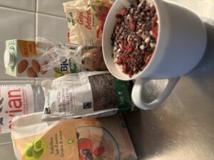 Hot oat bran with half cup of almond milk and half cup water. Topping: cacao beans , goji berries, plenty of very diverse seeds. Perfect before training, giving long time energy with vegetal proteins and low fat. As well good to recover after strong training